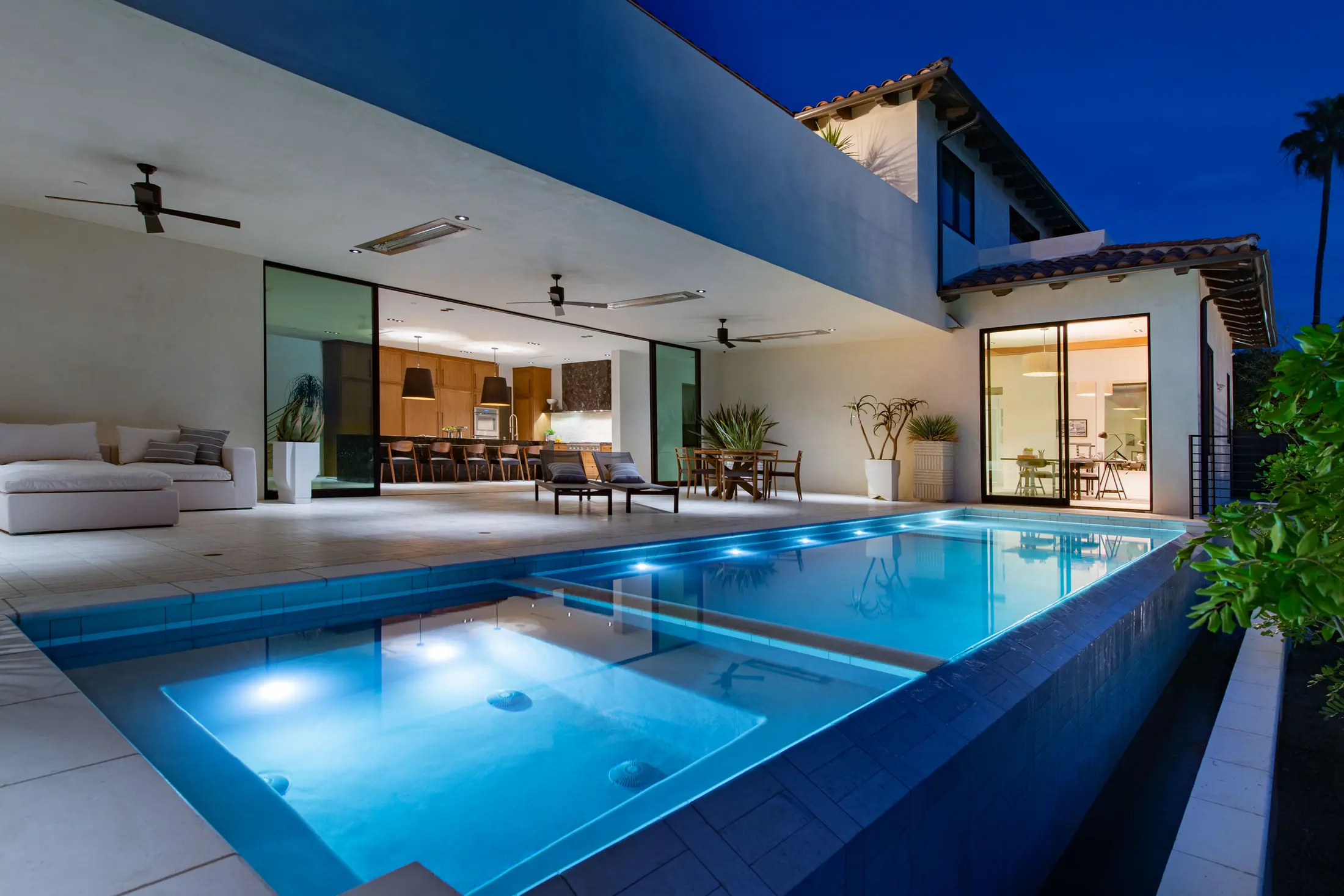 Modern courtyard residence and blue-lit pool
