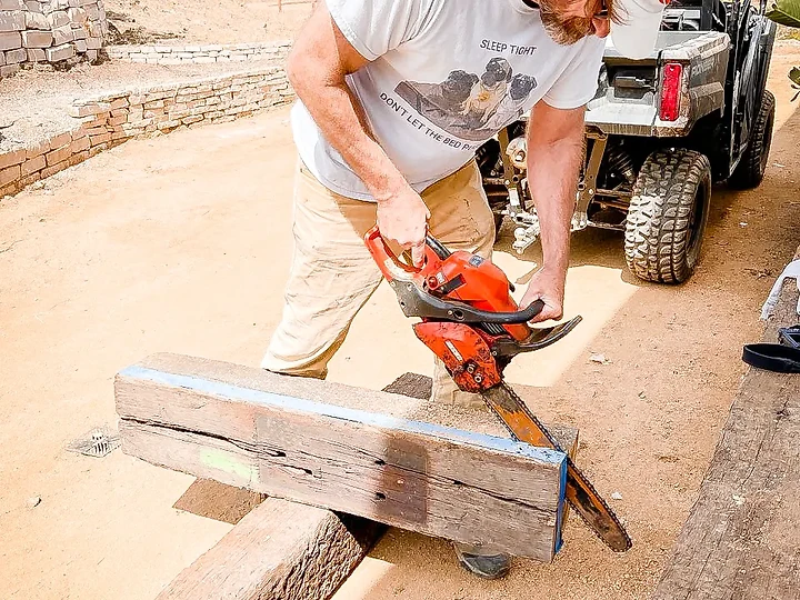 Cutting a reclaimed timber to length on site