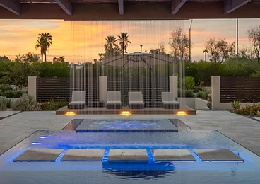 Pool Waterfall at Night at Paradise Reserve, a North Scottsdale luxury vacation rental estate