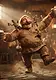 A joyful, heavy-set tavern keeper with a thick mustache and brown tunic dancing in a medieval pub while carrying small wooden figurines on his shoulders and holding mugs of frothy ale.
