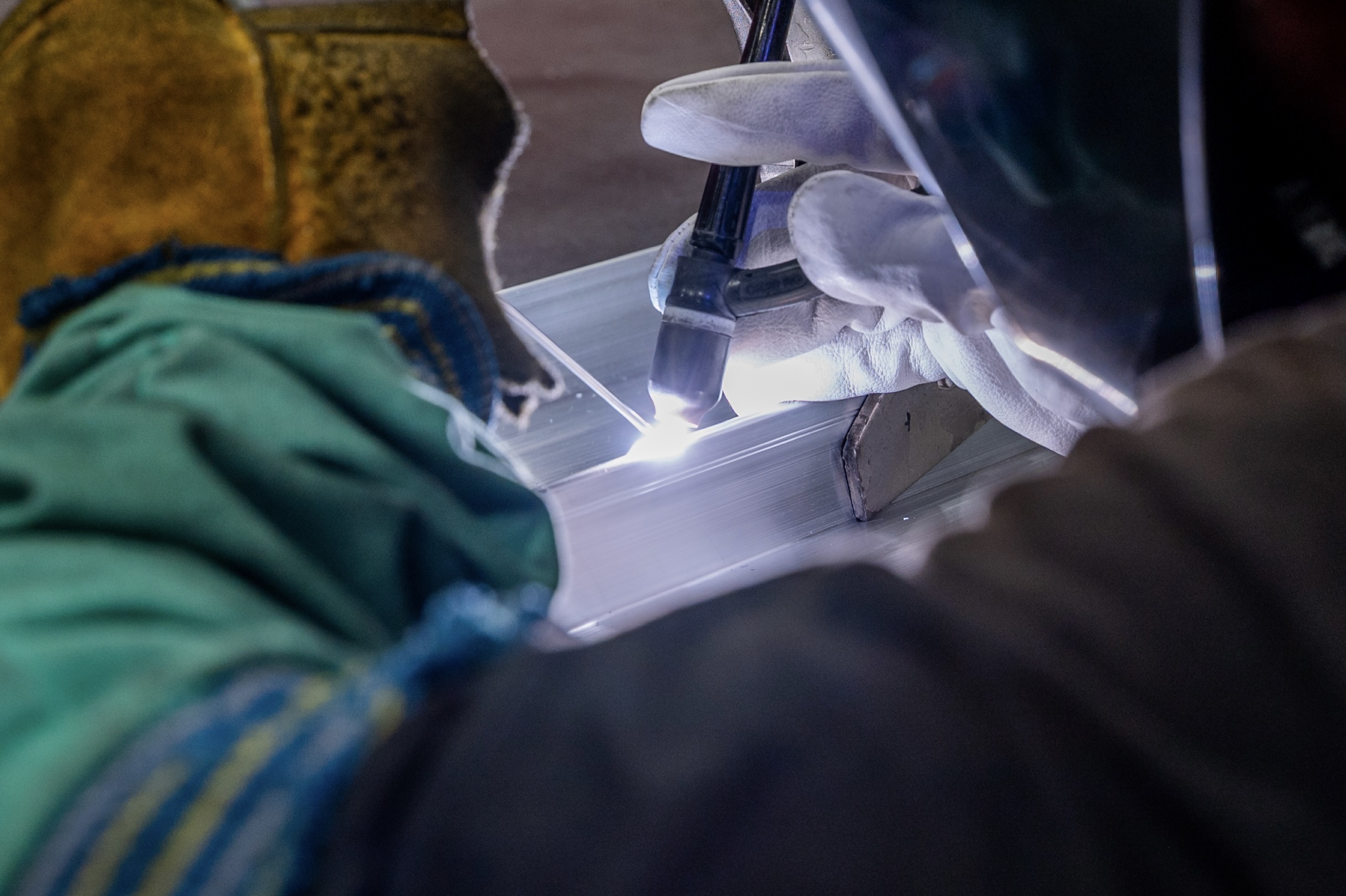 TIG welding close-up with bright arc at the torch tip