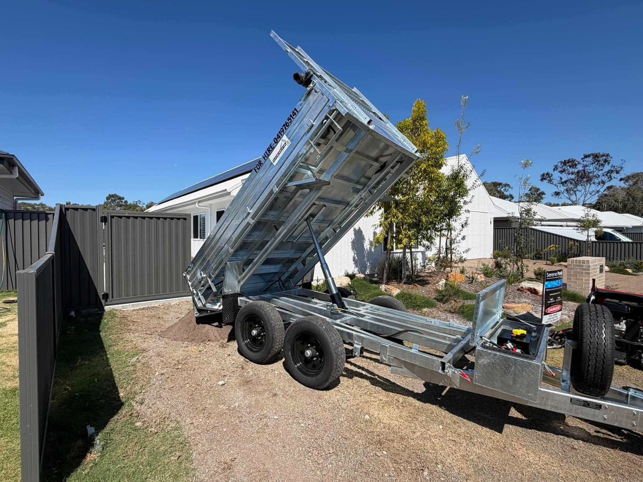 Raised tipper — side view