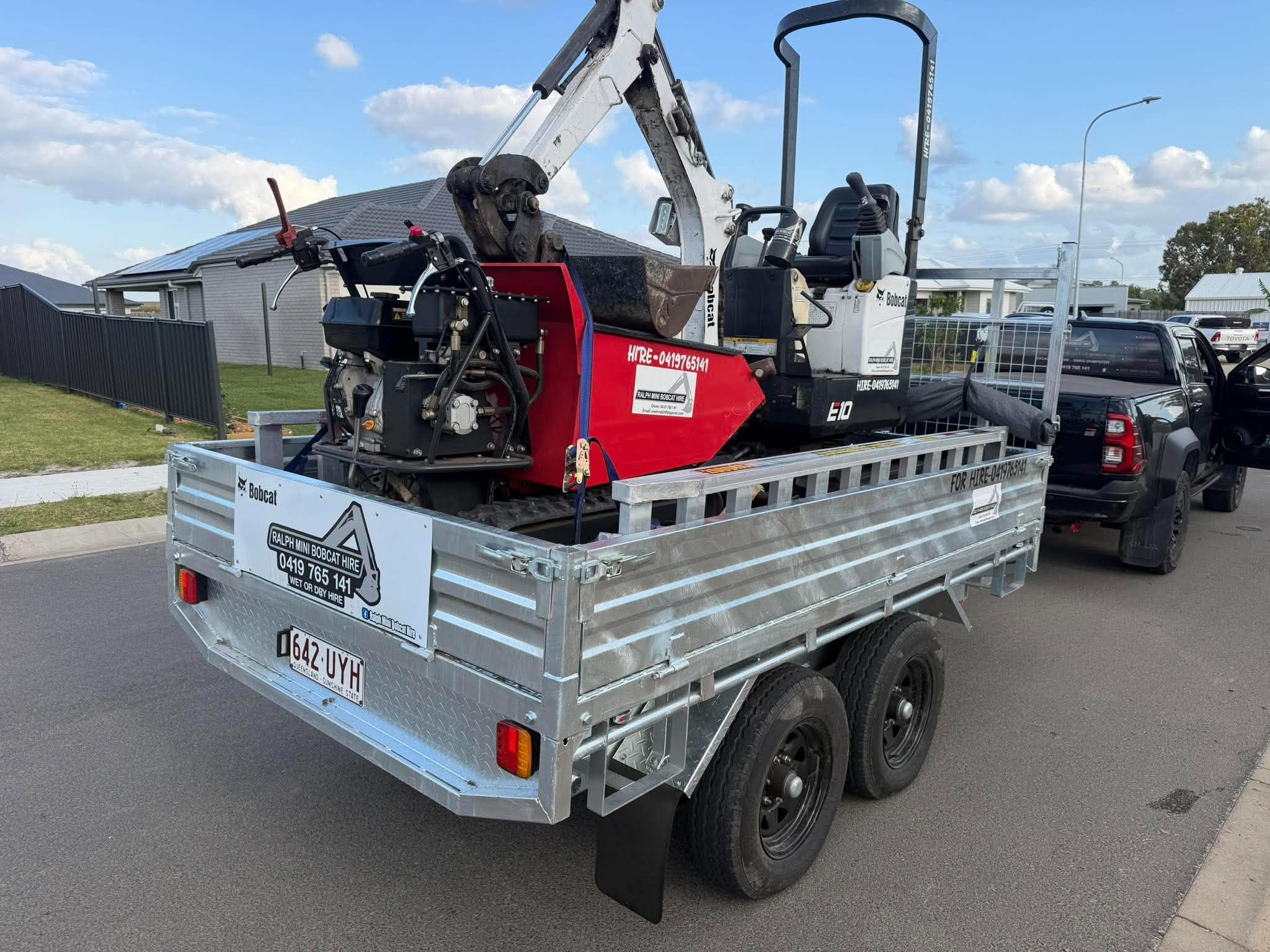 Trailer with excavator and mini dumper