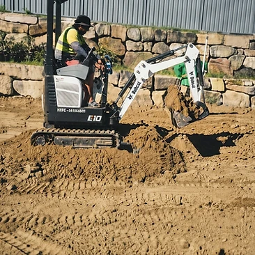 Sand levelling — retaining wall base