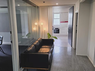 The lounge — sofa and hall to the kitchen
