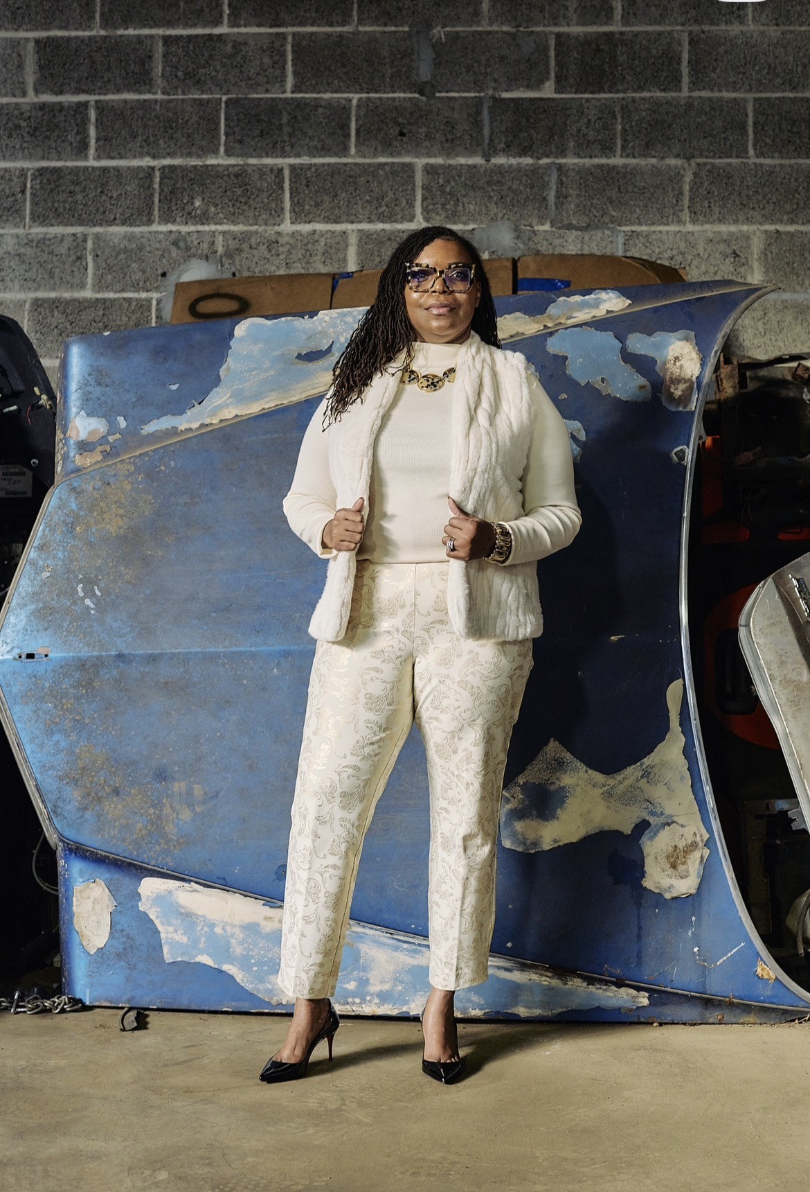 Natasha Broxton inside Select Auto Parts and Sales, Milwaukee, 125,000 sq ft indoor automotive recycling facility