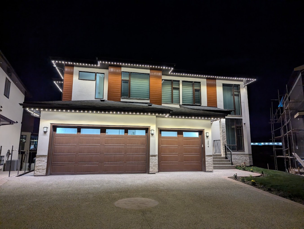 Crisp daylight-white permanent LED roofline lighting on a modern home