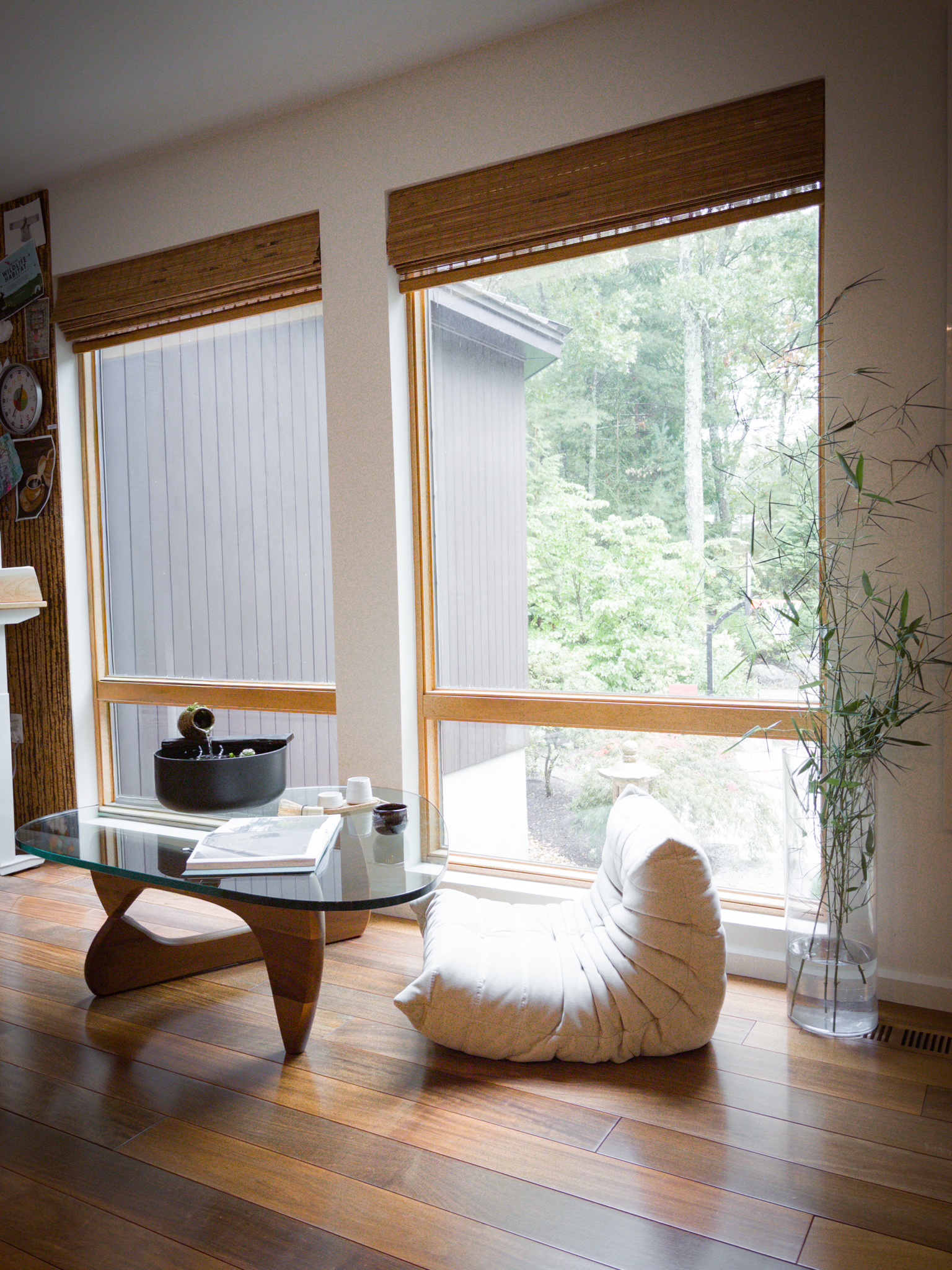 The Sanctuary Vessel in a sunlit room with bamboo shades and a low floor chair