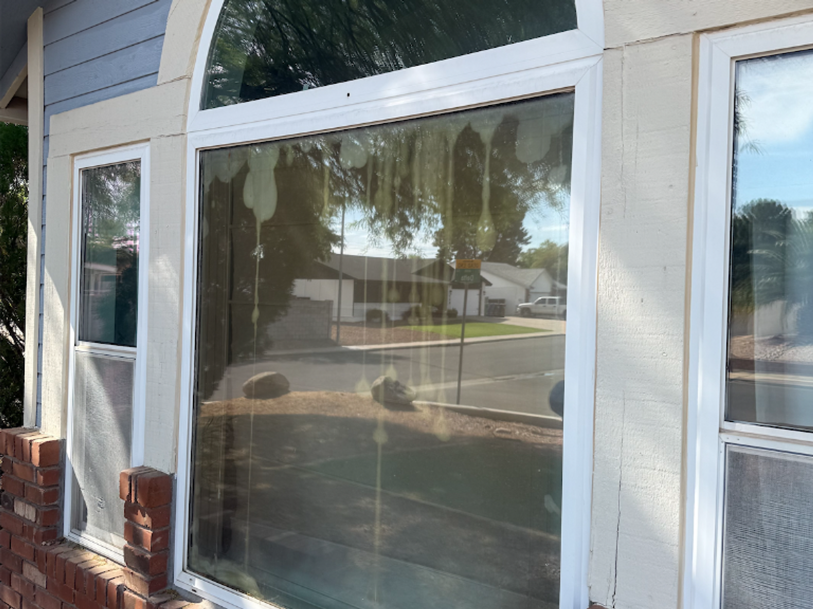 Fogged arched window restored by Honey Glass AZ - before