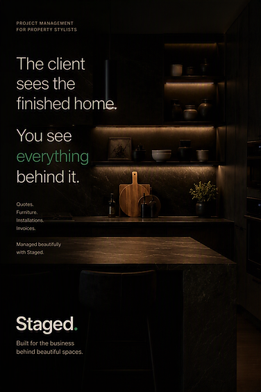 A dark modern kitchen with marble countertops and minimalist ceramics on open shelving