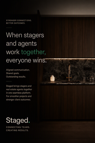 A dimly lit kitchen scene with dark cabinetry and a softly glowing white lamp on the countertop