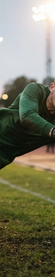 Football goalkeeper making a diving save