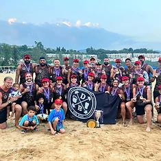 DBDB dragon boat squad posing on the beach post-race