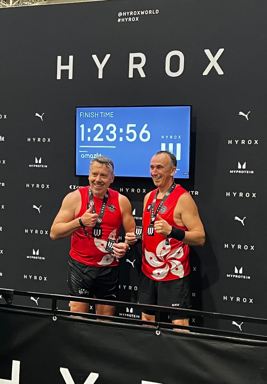 Neil Jensen and Trevor Smith after their first-place over-50s finish at HYROX Hong Kong