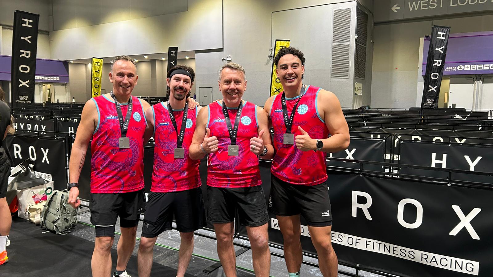 Four DBDB athletes with HYROX finisher medals after a strong race