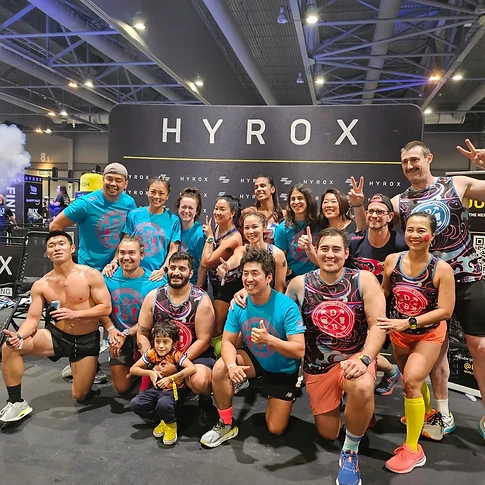 DBDB HYROX team posing in front of the HYROX backdrop