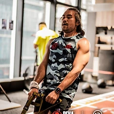 DBDB athlete training on the suspension trainer during a DEKA prep session