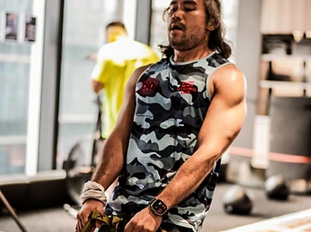 DBDB athlete training on the suspension trainer during a DEKA prep session