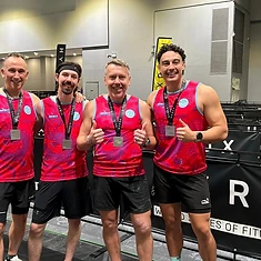 DBDB HYROX men with race medals on the competition floor