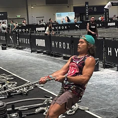 DBDB athlete mid sled pull during a HYROX race