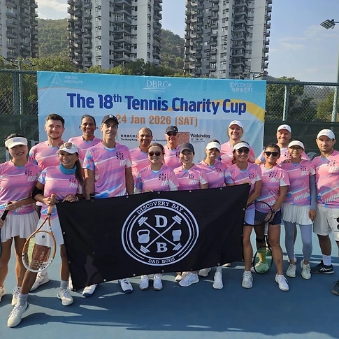 DBDB Tennis Team posing with the club flag at the Discovery Bay Charity Cup