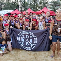 DBDB team celebrating with medals and flag after the races