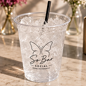 Branded cup with black straw