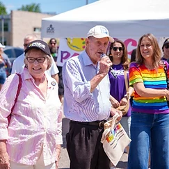 Mayor and community leaders speaking at the Pride in the Park event tent at the Milton Fairgrounds