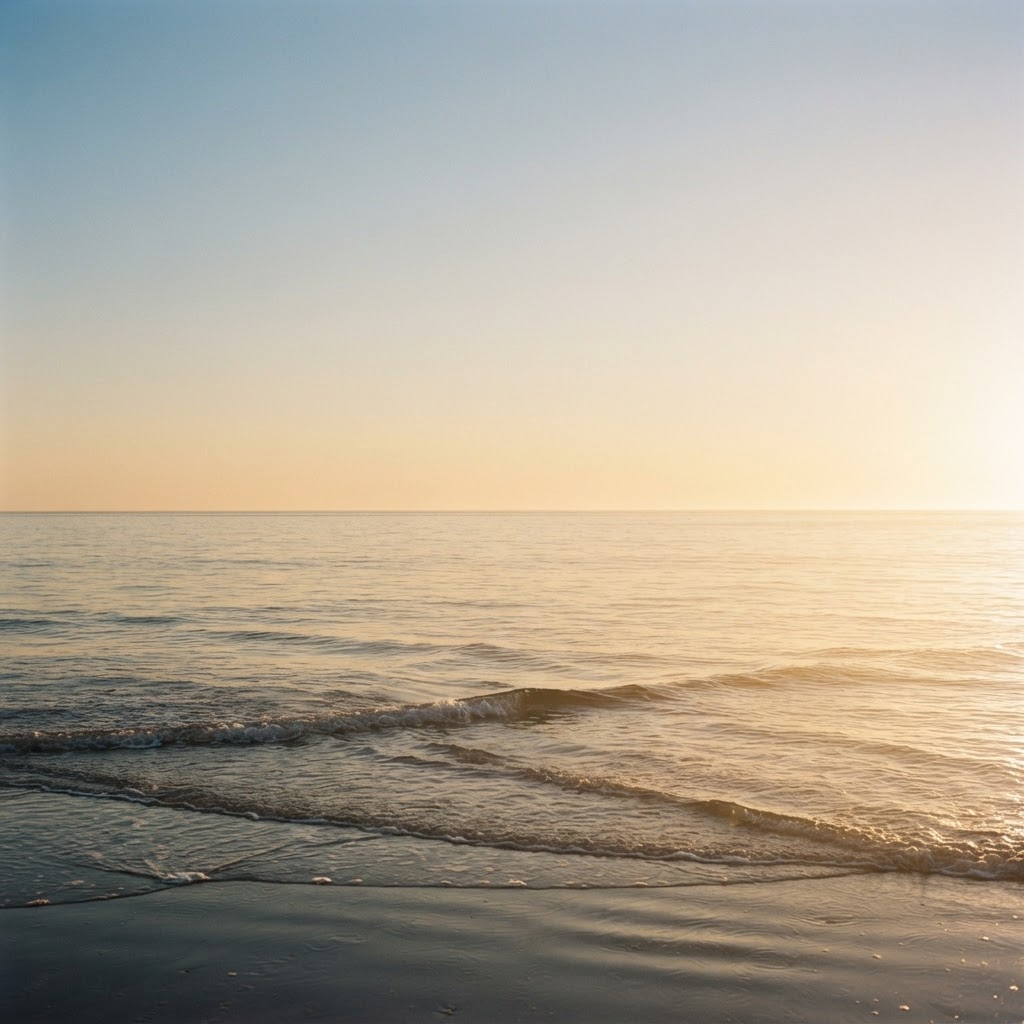 A serene sunlit ocean at golden hour