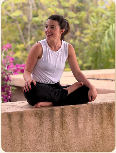 Mira seated calmly in the garden