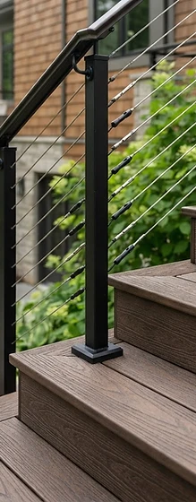Premium composite deck staircase detail with steel cable railings