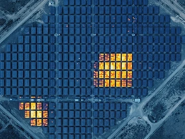 Aerial thermal infrared scan of solar panels revealing heat signature hotspots