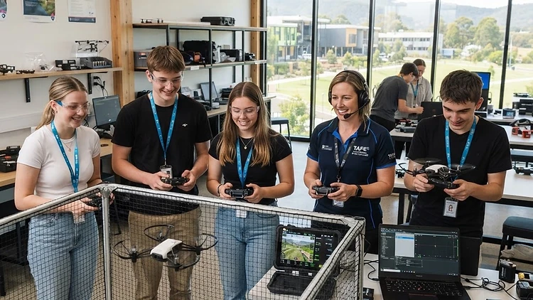 School leaver drone training workshop with instructor and students flying training drones