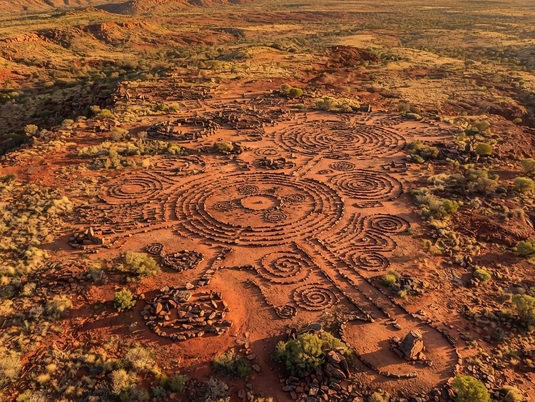 Aerial top-down survey of an Aboriginal heritage site with stone arrangements on red earth