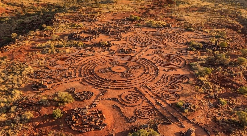 Aerial drone survey of an Aboriginal cultural heritage site showing stone arrangements on red earth