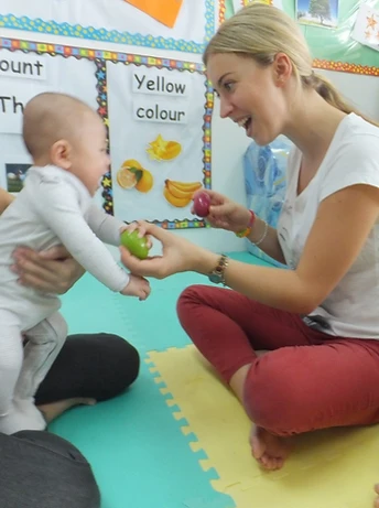 Educator with infant at Nurtureloft