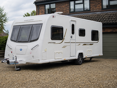 A touring caravan parked at a UK property