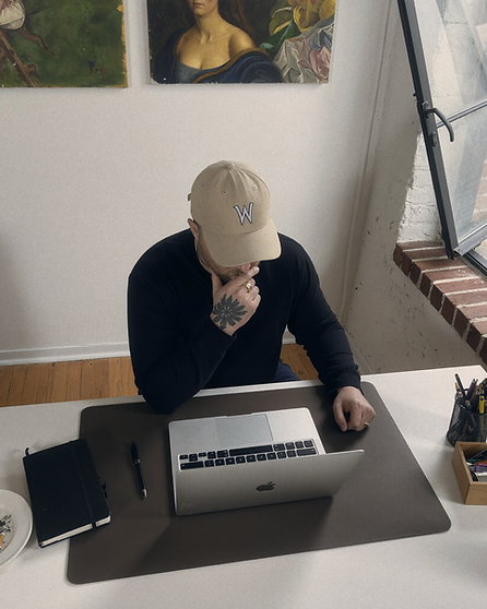 Amos Alexander working at a studio desk