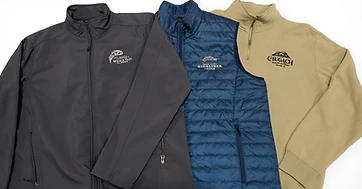 Three embroidered garments: softshell jacket, quilted vest, and quarter-zip pullover with lodge logos