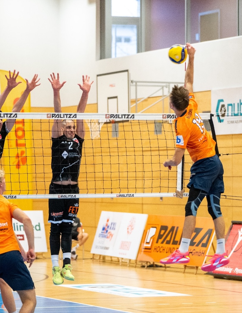 Professional volleyball action at the net