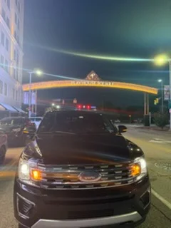 Black Ford Expedition beneath the Playhouse Square arch on Euclid Avenue at night
