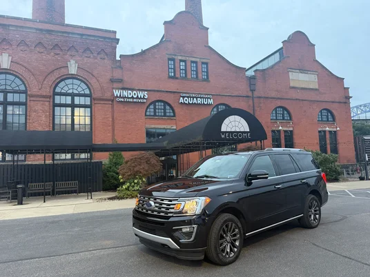 Black Ford Expedition parked outside Windows on the River and the Greater Cleveland Aquarium, Cleveland