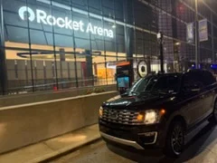 Ford Expedition with headlights on outside Rocket Arena, Cleveland