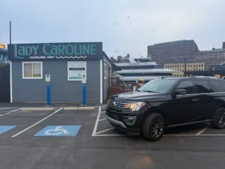 Ford Expedition beside the Lady Caroline on the Cuyahoga River