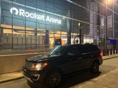 Black Ford Expedition outside Rocket Arena in downtown Cleveland at night