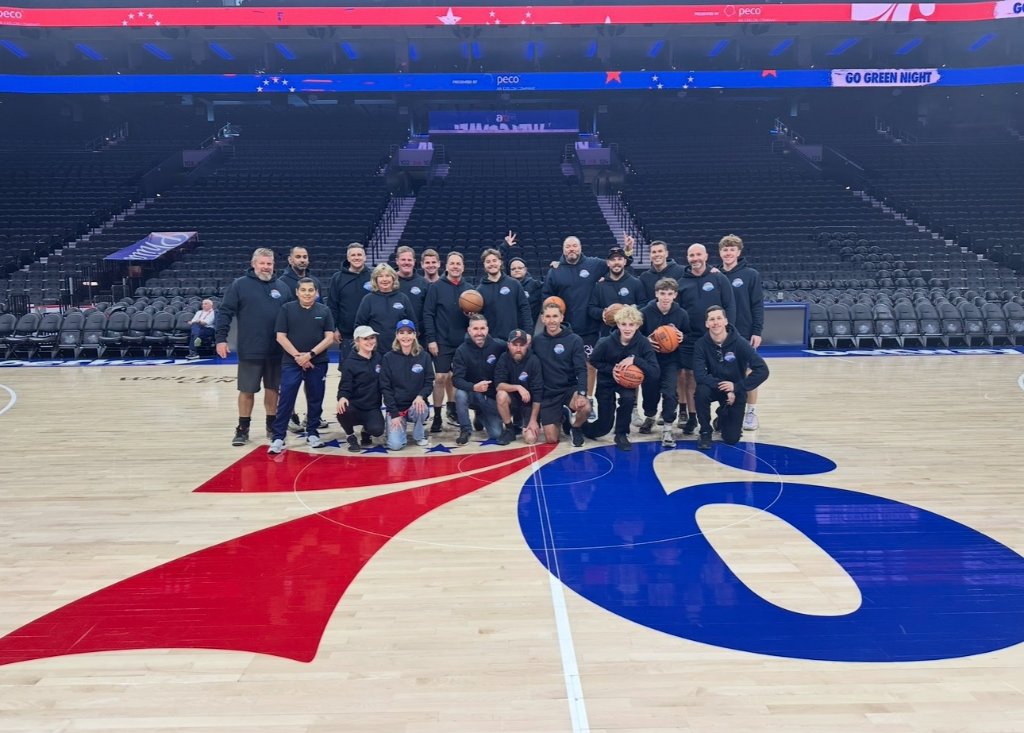 Group photo on the Philadelphia 76ers court