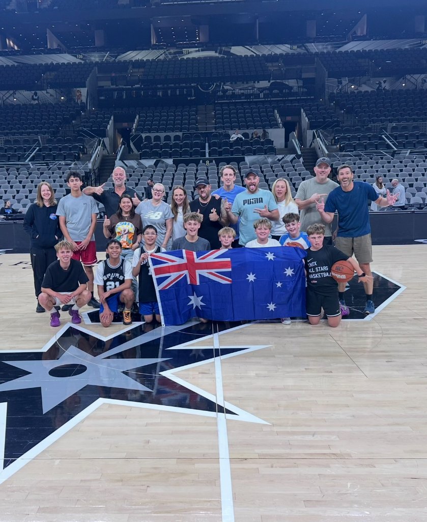 Group holding the Australian flag on the San Antonio Spurs court