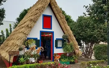 Traditional thatched triangular houses of Santana on the north coast of Madeira