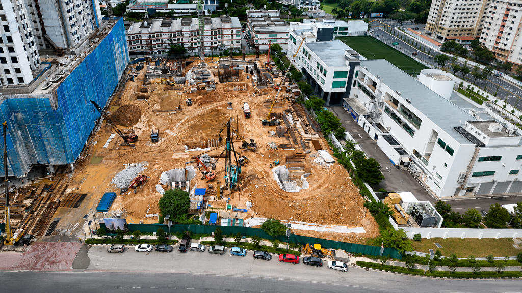 Drone view of Queenswoodz site, Q3 2026 — structure progress