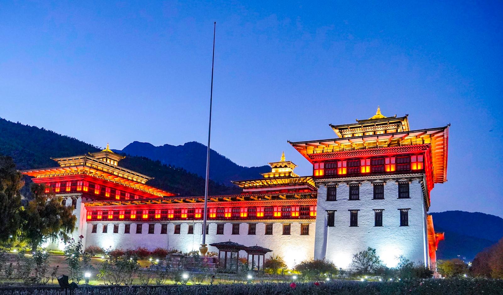 A Bhutanese dzong illuminated at twilight